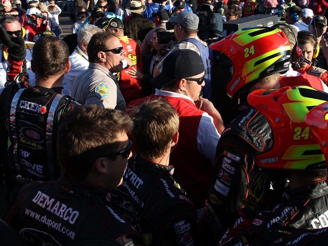 Police break up fights in the garage area between the crews of the No. 24 Chevrolet and No. 15 Toyota. The incident began when a crew member of Clint Bowyer’s appeared to have jumped Jeff Gordon after he exited his car.