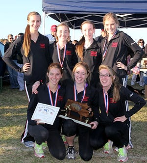 Members of the Whitman-Hanson Regional High girls cross country team took home show off their medals and trophy for winning the MIAA Eastern Mass. Div. 3 meet on Saturday in Wrentham. Members of the team are, back row from left: Abbie Newman, Caroline Mulrey, Megan Concannon and Kelsey Tierney. Front row, from left are, Gianna Cacciatore, Rachael Baker and Abby Baker.