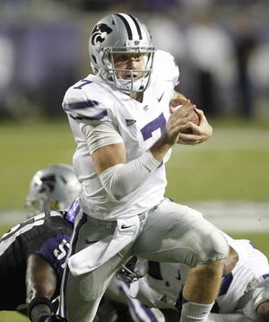 Kansas State quarterback Collin Klein runs for a first down in the Wildcats' 23-10 win over TCU on Saturday. Kansas State moved to No. 1 in the BCS standings Sunday.