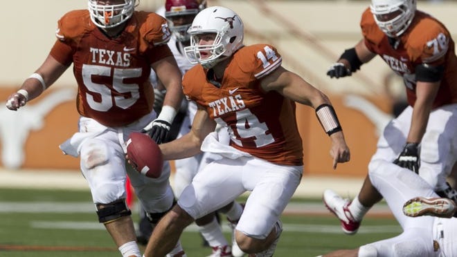 Texas Longhorns' (14) David Ash looks for room to run against the Iowa State Cyclones in the second half of an NCAA college football game at Darrell K. Royal Texas Memorial Stadium in Austin, TX, Saturday, Nov. 10, 2012.