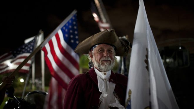 Ken Barnett, a member of the Patriot Guard Riders, attends ehe Royal Palm Beach Veterans Day Evening Service. (Brynn Anderson/The Palm Beach Post)