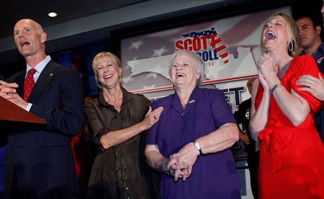 Esther Scott, second from right, mother of Florida Gov. Rick Scott, left, shares a laugh with her son on Nov. 3, 2010, his wife Ann, second from left, and her grandaughter Allison Guimard in Fort Lauderdale. The governor said his mother died Tuesday afternoon in her hometown of Kansas City, Mo. She was 84.(AP Photo/Wilfredo Lee, File)