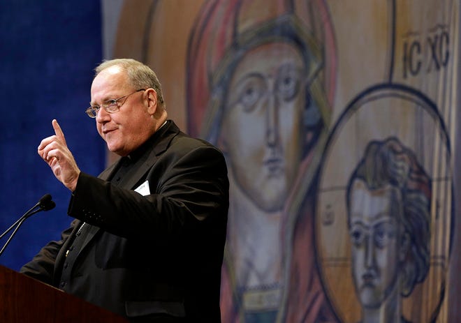 Cardinal Timothy Dolan, of New York, president of the United States Conference of Catholic Bishops, speaks at the conference's annual fall meeting in Baltimore, Monday, Nov. 12, 2012. (AP Photo/Patrick Semansky)