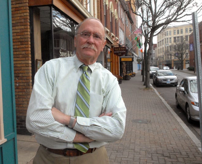 Greater Norwich Area Chamber of Commerce CEO Ben Lathrop stands on Main street in downtown Norwich.