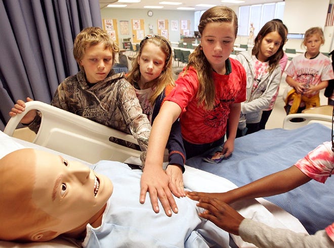 Parker Elementary School fifth-graders tour a lab at the Health Sciences Building at Gulf Coast State College on Tuesday.