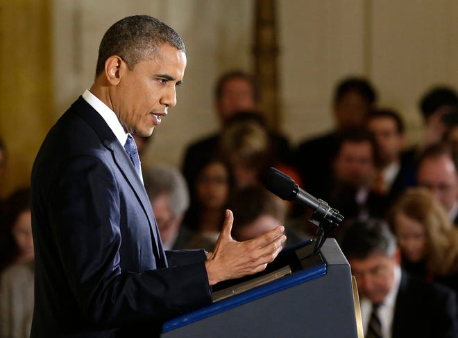 President Barack Obama answers a question during a news conference in the East Room of the White House in Washington on Wednesday. The president touched on various topics including the widening sex scandal, UN Ambassador Susan Rice and possibly meeting with his recent presidential rival Mitt Romney.