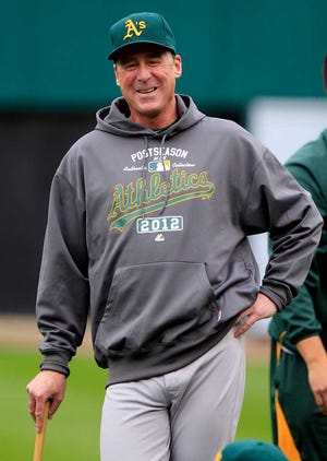 FILE - In this Oct. 5, 2012, file photo, Oakland Athletics manager Bob Melvin smiles before batting practice in preparation for Game 1 of the American League division baseball series against the Detroit Tigers in Detroit. Melvin was voted as the American League Manager of the Year on Tuesday, Nov. 13, 2012. (AP Photo/Carlos Osorio, File)