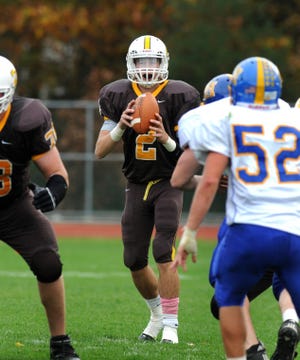 Delran High School quarterback Justin McFadden drops back during a game against Maple Shade High School on Saturday, October 27, 2012.