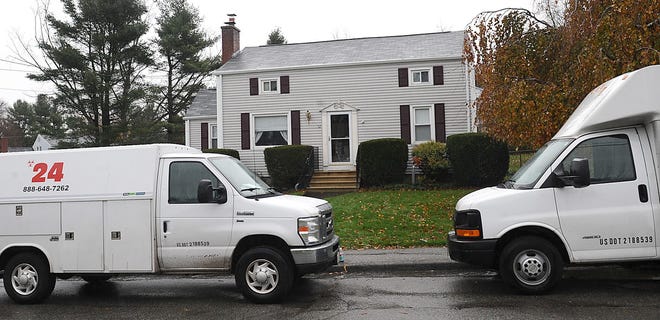 Crime scene clean-up trucks were parked Tuesday afternoon in front of 52 Meadow Brook Road in Marlborough, where a fatal police-involved shooting occurred Monday night.
