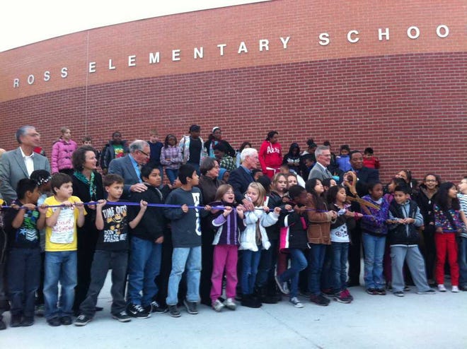 Ross Elementary students gather outside the school Thursday to celebrate its expansion.