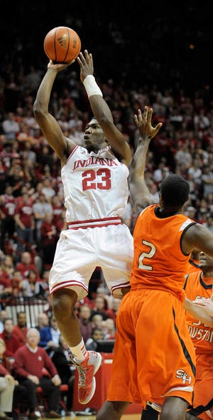 Indiana guard Remy Abell shoots over Sam Houston State guard Marquel McKinney on Thursday in Bloomington, Ind. Indiana won, 99-45.