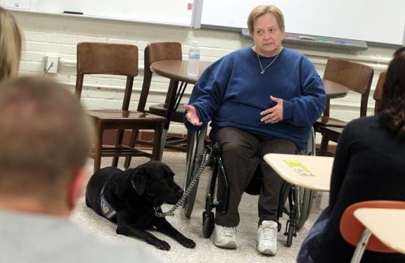 Polio survivor Joan Eslick talks with students in Becky Anthony’s class at Kings Mountain High School. (Brittany Randolph/The Star)