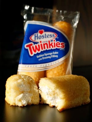 FILE - This Tuesday, Jan. 10, 2012, file photo, shows, Hostess Twinkies in a studio in New York. Hostess Brands Inc. announced Thursday, Nov. 15, 2012, that it is warning striking employees that it will move to liquidate the company if plant operations don't return to normal levels by Thursday evening. The maker of Twinkies, Ding Dongs and Wonder Bread said Thursday it will file a motion in U.S. Bankruptcy Court to shutter operations if enough workers don't return by 5 p.m. EST. That would result in the loss of about 18,000 jobs.( AP Photo/Mark Lennihan)