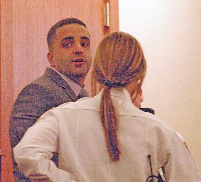 "Last Glance"
Nelson Melo of Taunton looks back to family members after being sentenced Friday to life in prison for the first degree murder of Chad Fleming.
Taunton Gazette photo by Charles Winokoor
