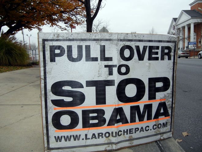 his sign encouraged motorists to stop in front of the Waynesboro Post Office Thursday and speak with LaRouchePAC volunteers about impeaching President Barack Obama. Numerous other signs, including Obama with a Hitler mustache, were also seen.