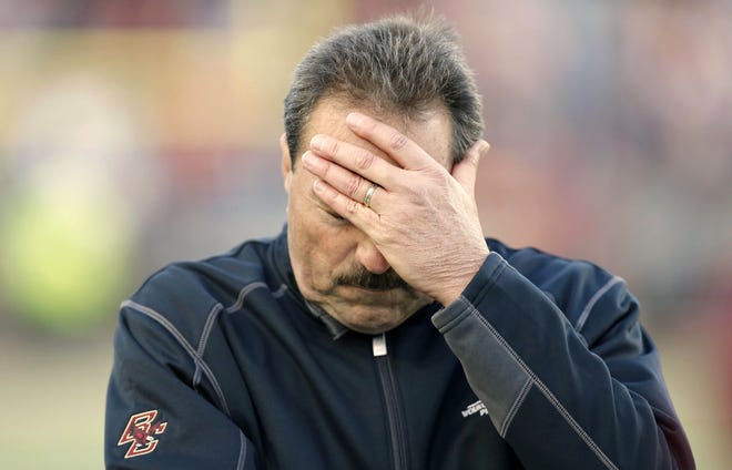 Boston College head coach Frank Spaziani holds his head during the second half of the Eagles' 30-23 loss to Virginia Teach on Saturday in Chestnut Hill.