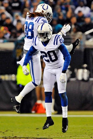 Indianapolis Colts defensive back Darius Butler (20) celebrates with defensive back Sergio Brown (38) after recovering a Jacksonville Jaguars fumble during the second quarter of an NFL football game, Thursday, Nov. 8, 2012, in Jacksonville, Fla. (AP Photo/Stephen Morton)