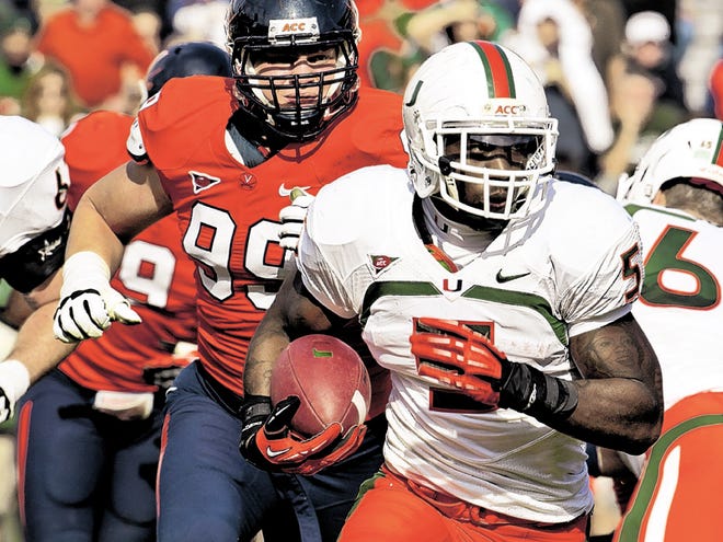 Miami running back Mike James (5) looks for running room as he is chased by Virginia defensive tackle Brent Urban (99) during an NCAA college football game in Charlottesville, Va., Saturday, Nov. 10, 2012.