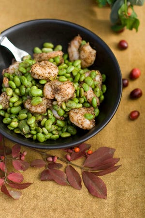 Roasted pepper shrimp with edamame is a different kind of green for Thanksgiving. (AP Photo/Matthew Mead)
