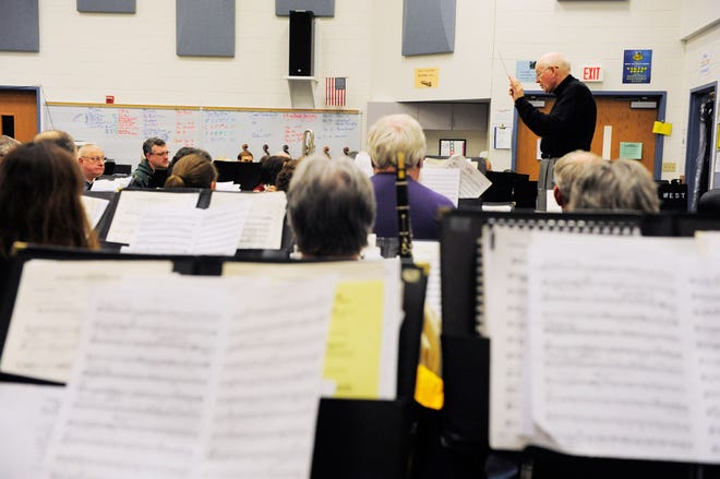 Patterson conducts the Columbia Community Band during a rehearsal at West Junior High School.
