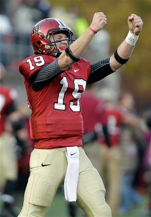 Harvard quarterback Colton Chapple (19) celebrates a touchdown during the second half of Saturday's game with Yale.