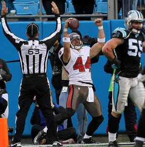 Tampa Bay’s Dallas Clark celebrates after catching the winning touchdown pass in overtime to beat the Panthers’ 27-21 on Sunday at Bank of America Stadium.