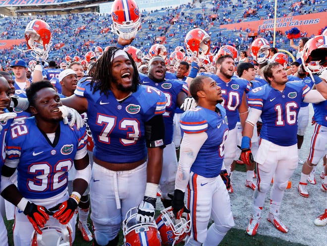 The Gators celebrate after defeating Jacksonville State 23-0 at Ben Hill Griffin Stadium in Gainesville Saturday.