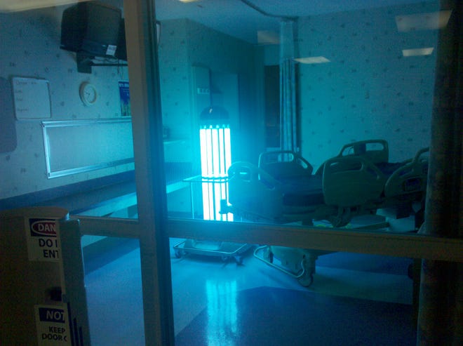 A robot cleans from a hospital room. Alamance Regional is employing the robot in its facilities.