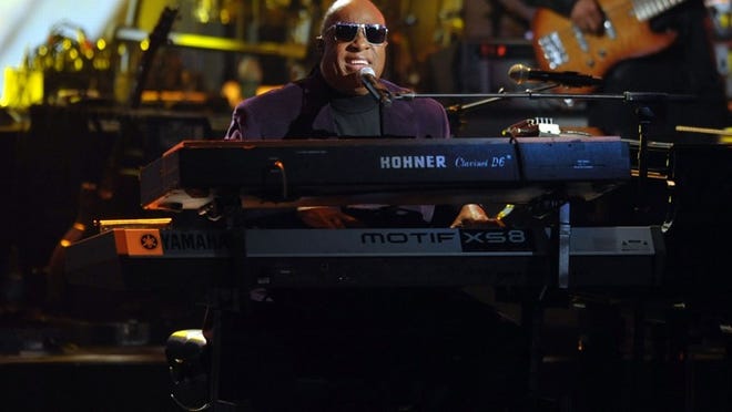 Stevie Wonder and the Rickey Minor Band perform “Master Blaster”, “My Cherie Amour” and “Sir Duke” as a tribute to Dick Clark at the 40th Anniversary American Music Awards on Sunday.