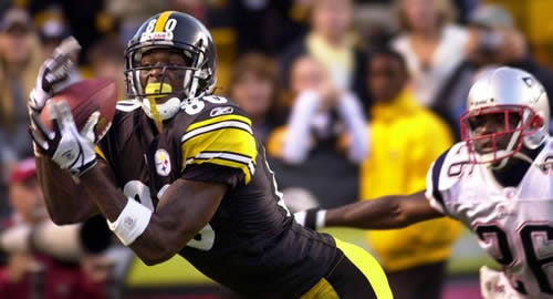 Plaxico Burress makes a touchdown catch against the New England Patriots during a game in 2004. Burress signed with the Pittsburgh Steelers Tuesday to bolster the team's injury-depleted offense.