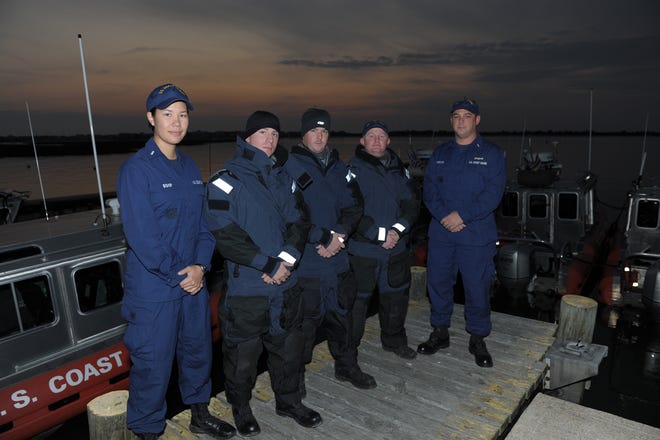 From left, Lt. j.g. Sharon Bishop, PO3 Jeremy Warren, PO3 Adam Darnell, PO2 Codey Schaffner and Lt. j.g. Jason Harczak of Maritime Safety and Security Team Kings Bay deployed to Coast Guard Station Barnegat Light, N.J., prepare for an evening law enforcement patrol, Saturday, Nov. 10. Members of MSST Kings Bay deployed to the Jersey Shore following Hurricane Sandy to provide law enforcement capabilities and to work with local police.