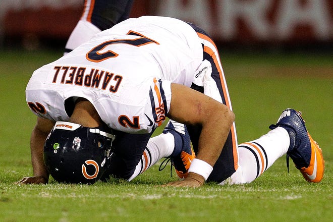 Chicago Bears quarterback Jason Campbell (2) gets off the ground after being tackled during the second half of an NFL football game against the San Francisco 49ers in San Francisco, Monday, Nov. 19, 2012. (AP Photo/Tony Avelar)