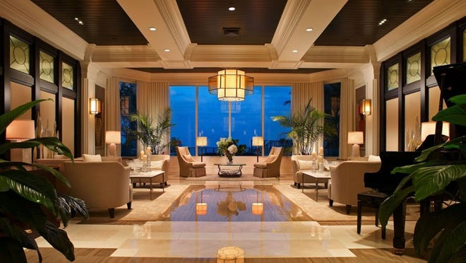 A dedicated staff accommodates the building’s residents. Services include a 24-hour concierge. The lobby is shown above.