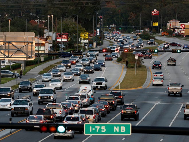 Traffic moves west on Archer Road on Tuesday.