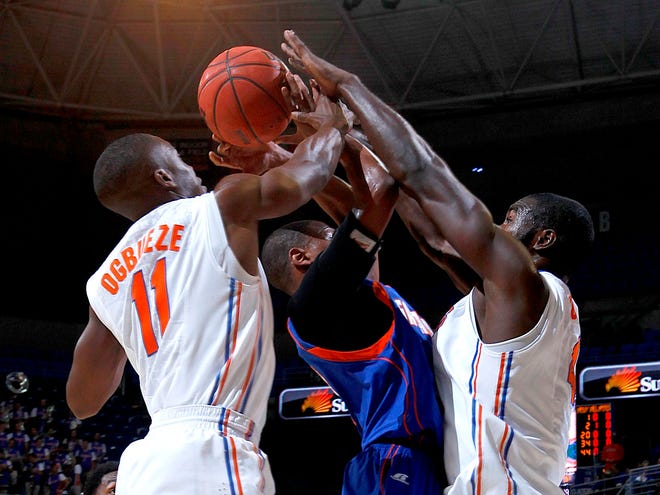 Florida Gators guard Braxton Ogbueze and center Patric Young block the shot of Savannah State Tigers guard Khiry Whiteon during the first half on Tuesday Nov. 20, 2012 at the Stephen C. O'Connell Center in Gainesville.
