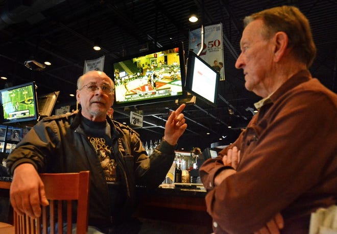 John Sydlo and Bob Reiss, both from Trenton discuss at Alstarz Sports Pub in Bordentown Township about Rutgers University football leaving the Big East for the Big Ten.