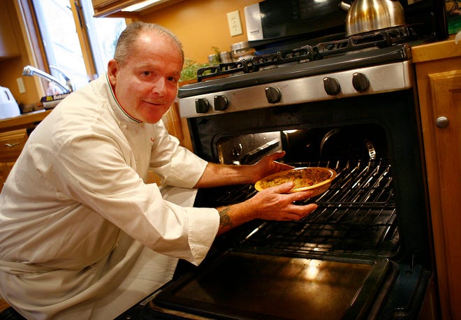 John Lambiase, chef at Bridgeman's in Hull, prepares a traditional Thanksgiving dinner for his family. 





FEATURES Photo