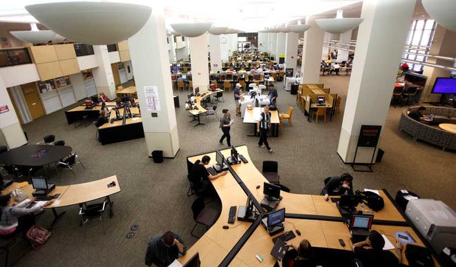 Students work in the Library at Texas Tech Tuesday. (Stephen Spillman / Lubbock Avalanche-Journal)