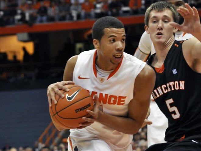 Syracuse's Michael Carter-Williams drives against Princeton's T. J. Bray (5) during the first half of an NCAA college basketball game, Wednesday, Nov. 21, 2012, in Syracuse, N.Y.