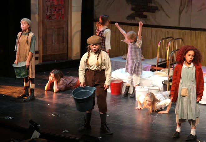 An opening scene of Annie and the Orphans during dress rehearsal at A Company Theater in Norwell for the production of Annie, Tuesday, Nov. 19, 2012.