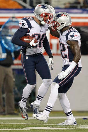 The Patriots' Steve Gregory celebrates after returning an interception for a touchdown during last night's game against the Jets.