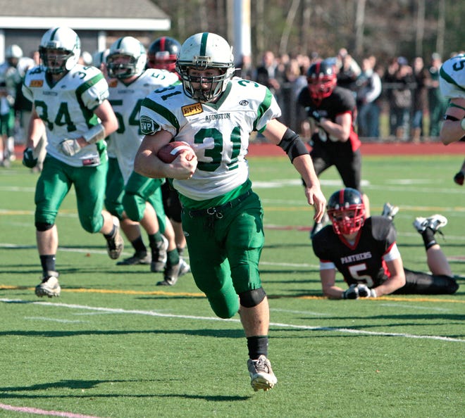 Abington's Pat Dwyer runs the ball in for a touchdownduring the Green Wave's 27-16 victory over Whitman-Hanson on Thursday.
