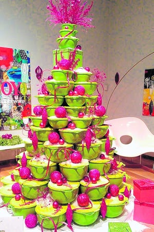 Trees like this Tupperware Tree, left, and Candy Cane Couple Tree -- 
featured this year at the Orlando Museum of Art's Festival of Trees -- 
stretch the imagination, and challenge visitors to get out of their holiday 
décor ruts.PHOTOS BY MARNI JAMESON