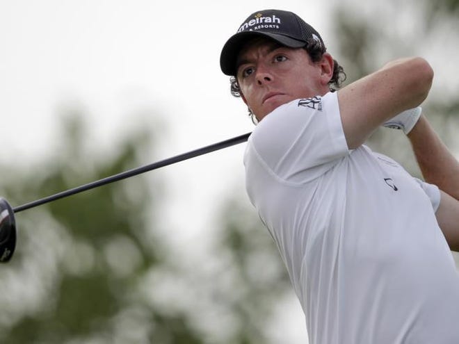 Rory McIlroy of Northern Ireland tees off on the 9th hole during the round two of DP World Golf Championship in Dubai, United Arab Emirates, Friday Nov. 23, 2012.