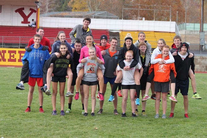 Members of the Yreka High cross country team pose for a photo before practice on Monday. The team is heading to Fresno today to compete in the state championship on Saturday. Daily News photo/Bill Choy