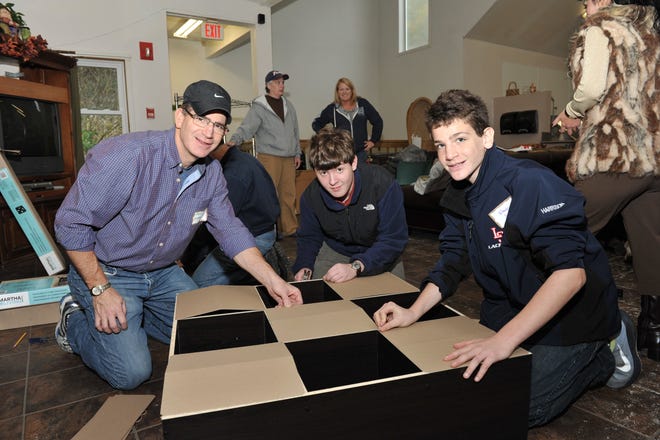 Jeff Harrison, Evan Berkowitz and Noah Harrison, all of Sudbury, built cubbies to help the residents at Serenity House in Hopkinton