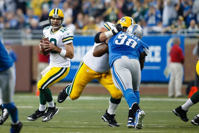 AP Quarterback Aaron Rodgers, left, has engineered the Green Bay Packers to a five-game winning streak. The Packers face the New York Giants, who have lost their last two games.