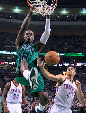 Celtics forward Jeff Green dunks against Oklahoma City forward Nick Collison and center Hasheem Thabeet (34) during Boston's win at TD Garden on Friday night.