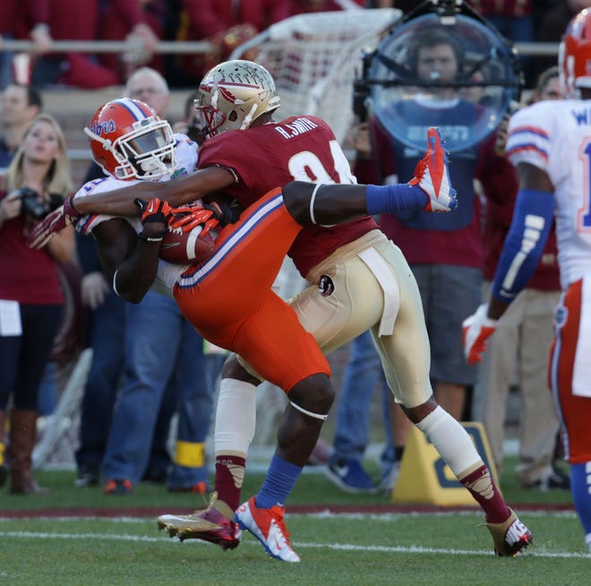 Rodney Smith makes a tackle on one of three Florida State interceptions.