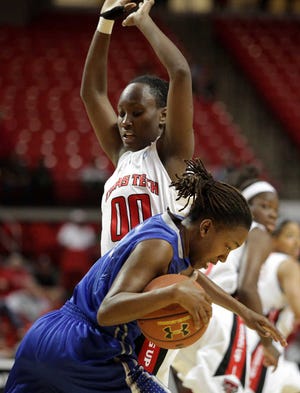 Texas Tech's Chynna Brown blocks the way as New Orleans' Keri Thomas looks to move past her during the game at the United Spirit Arena on Sunday, Nov. 25, 2012.(Scott MacWatters for the Lubbock Avalanche-Journal)